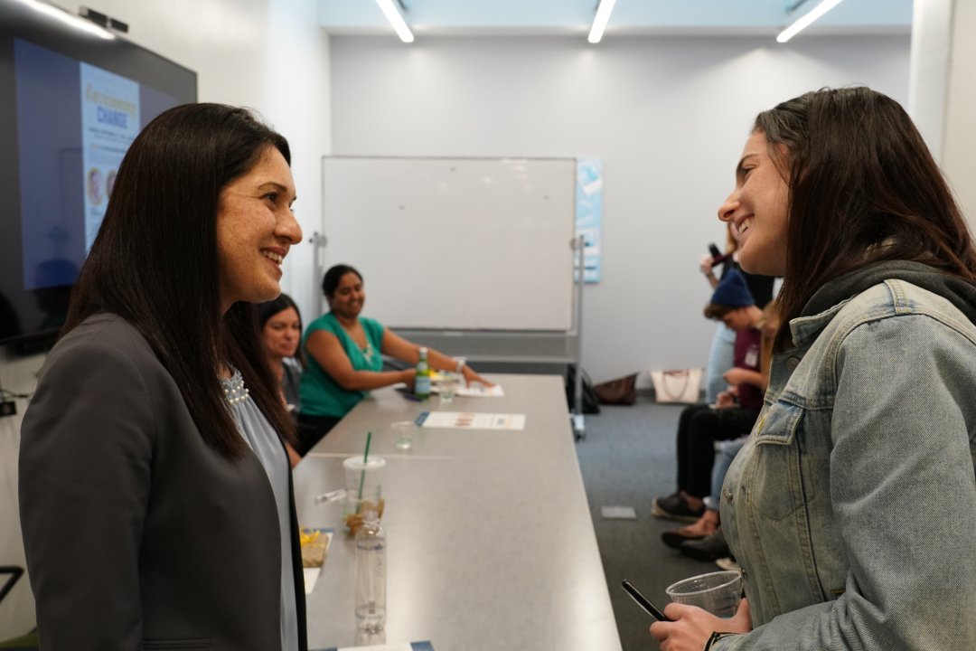 Kavita Daiya speaking to a graduate student