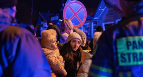 Women in Ukraine stand in line for transport  Credit: Natalie Keyssar / New York Times