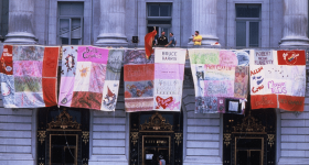 The AIDS Memorial Quilt on display from San Francisco’s city hall in 1987  Credit: HIV Plus Magazine