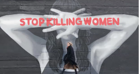"stop killing women" written on the arms of a mural